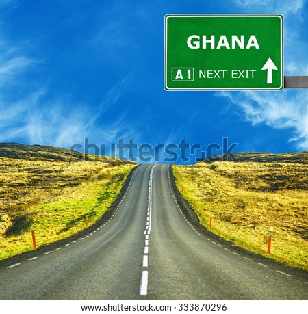 GHANA road sign against clear blue sky