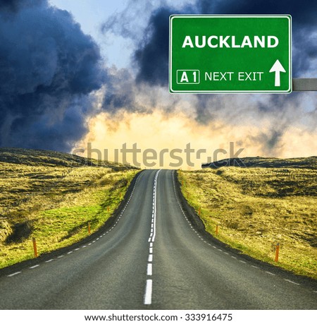 AUCKLAND road sign against clear blue sky
