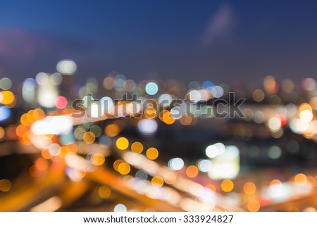 Aerial view city road intersection, blurred bokeh light background