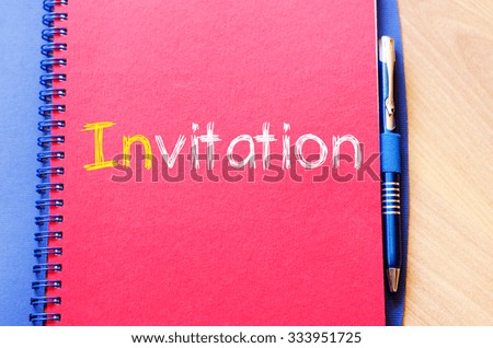 Invitation text concept write on notebook