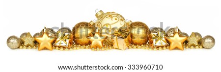 Christmas border of gold ornaments, presents and beads isolated on a white background