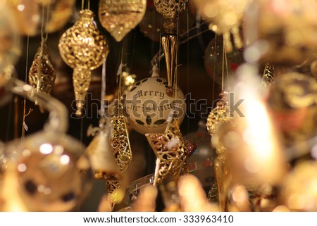 Closeup view of many beautiful christmas or new year fir tree decoration of round colorful toy on blurred background, horizontal picture