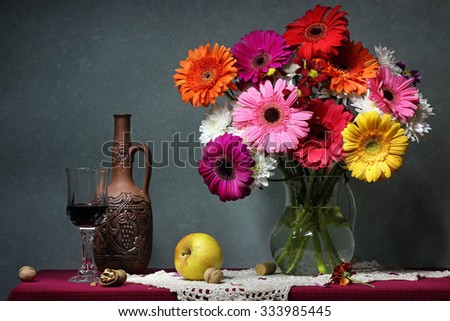 Still life with Transvaal daisies, walnuts, apples and red wine. Congratulation, card, invitation.