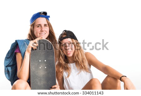 Two friends with their skateboards