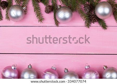 Christmas decoration on a pink wooden background for your congratulation