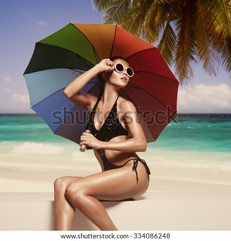 Beautiful woman sunbathing at the seaside