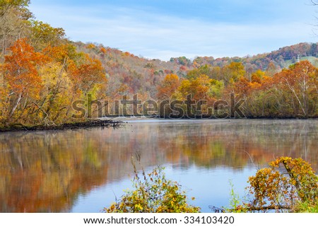 Fall color at Norris Dam State Park Royalty-Free Stock Photo #334103420
