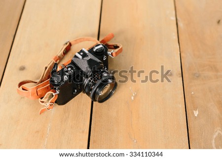 Black Vintage Camera on wooden table