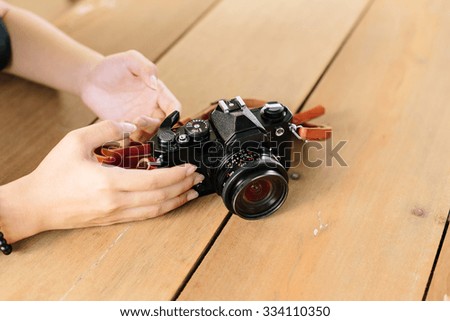 Black Vintage Camera on wooden table