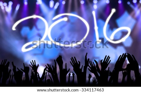 Silhouette of people hands raised upward to celebrate new year of 2016 in the party
