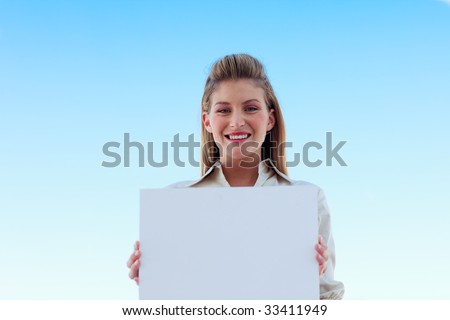 Beautiful businesswoman holding a white business card