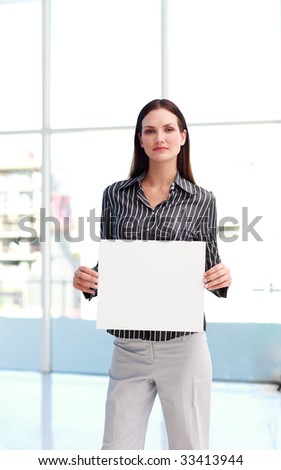 Attractive businesswoman presenting a white card