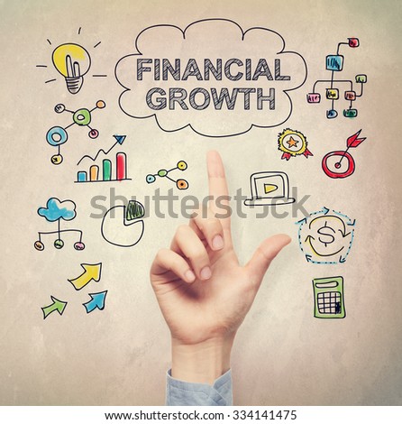 Hand pointing to Financial Growth concept on light brown wall background
