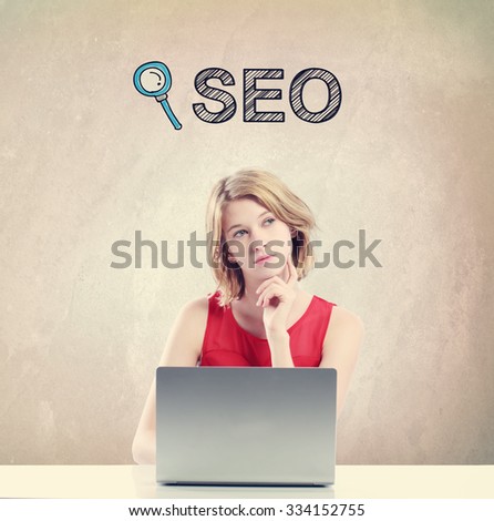 SEO concept with young woman working on a laptop 