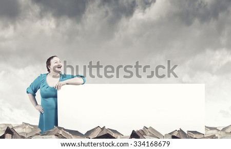 Stout confident woman of middle age with blank white banner