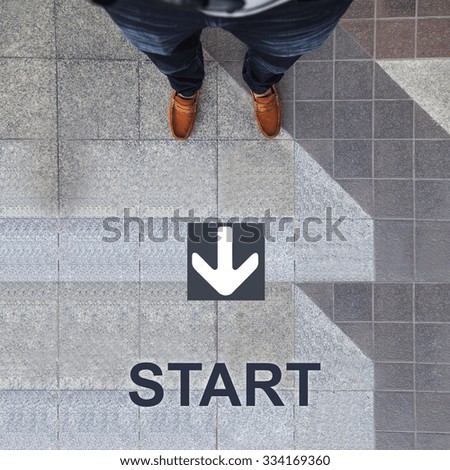 Pair of shoes standing with start and white arrow