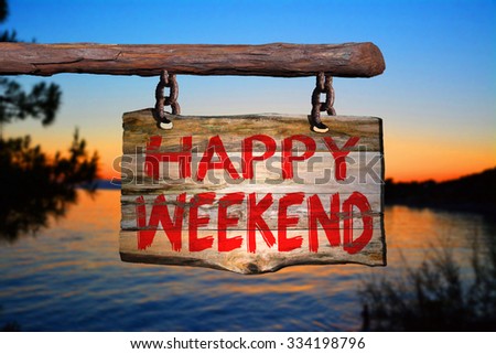 Happy weekend motivational phrase sign on old wood with blurred background