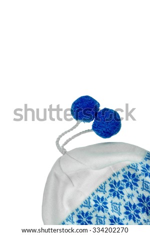 White Knitted Female Warm Beanie With Two Blue Pompom On The Rope Isolated On White Vertical Background