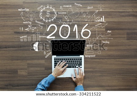 2016 new year business success, Creative thinking drawing charts and graphs strategy plan ideas wooden table background, Inspiration concept with businessman working on laptop computer PC, Top View Royalty-Free Stock Photo #334211522