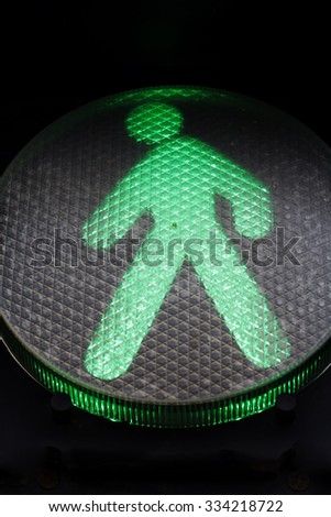 green traffic sign for pedestrians, traffic rules