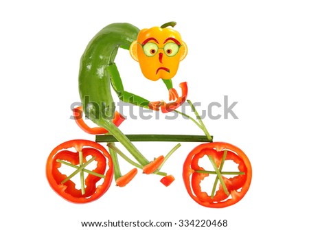 Healthy eating. Funny little  pepper  on a bicycle