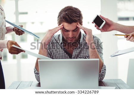 Businessman stressed out at work in casual office Royalty-Free Stock Photo #334226789