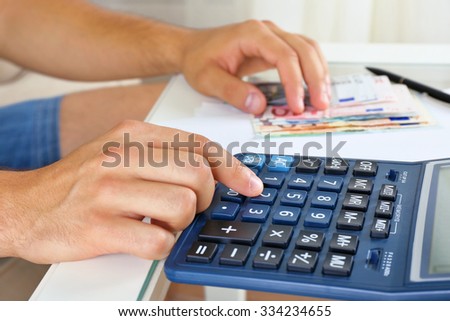 Calculating money, close up