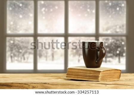 brown mug book and window space 