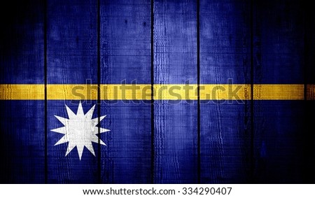 nauru Flag on old wood texture background
