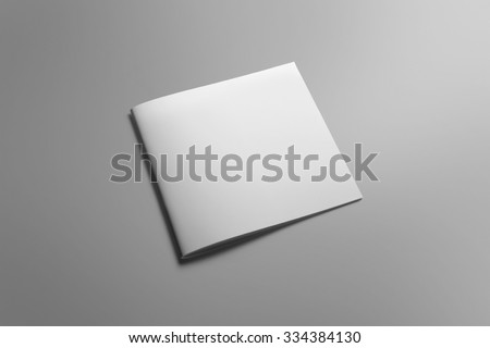 Blank square brochure magazine isolated on grey, with clipping path, changeable background Royalty-Free Stock Photo #334384130