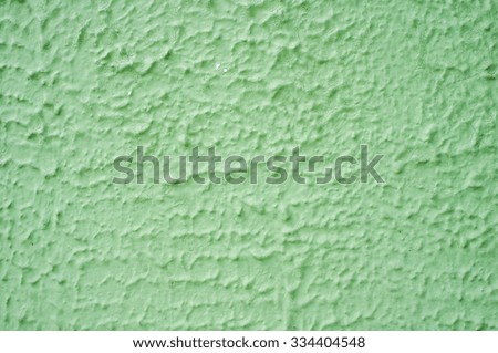 Green rough concrete painted wall texture background