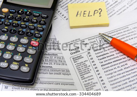 taxation concept: form with calculator, money, pen