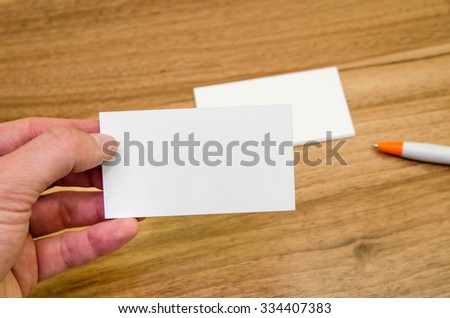 Formal style business cards presentation on wooden background