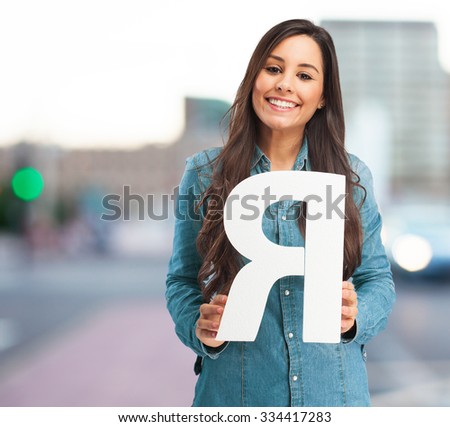 happy young woman with letter r