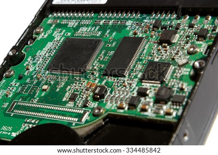 A close up picture of a green motherboard 