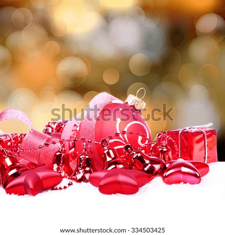 Christmas background with red balls, bells, stars and bokeh lights