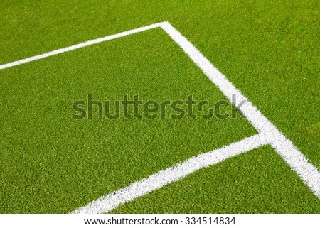 green empty football soccer field with corner under daily light