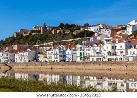 View of city Alcacer do Sal near the river Sado in Portugal. Horizontal shot