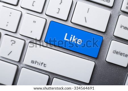 Closeup picture of like button of a modern keyboard. Royalty-Free Stock Photo #334564691