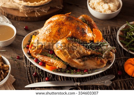 Homemade Roasted Thanksgiving Day Turkey with all the Sides Royalty-Free Stock Photo #334603307