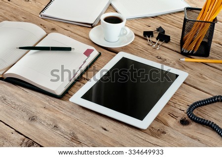 White tablet with in the workplace closeup. Copy space. Top view. Free space for text