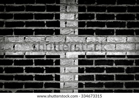 Dark brick wall texture - flag painted on wall - Cornwall