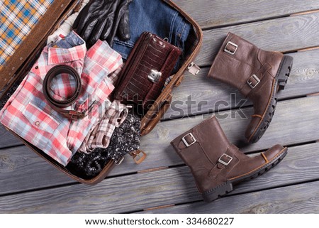 Suitcase traveler. A set of clothes for the trip.