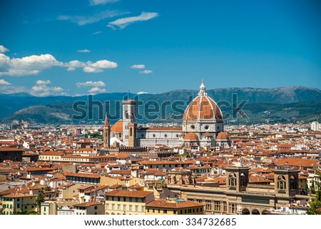 Cathedral of Santa Maria del Fiore in Florence, Italy. Beautiful cityscape image with red roofs of renaissance and medieval architecture.