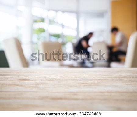 Table Top with Blurred People in Lobby Interior background