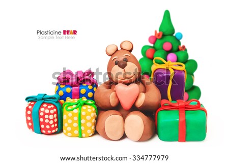 Plasticine Christmas happy bear with pine tree gift holiday boxes on a white background