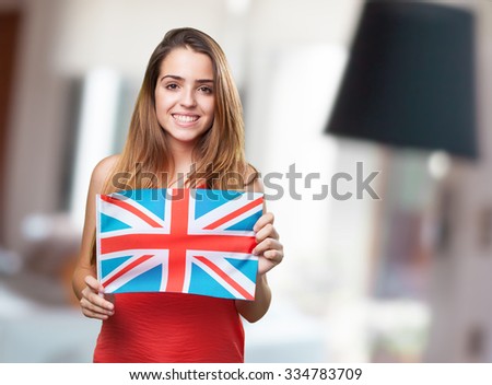 young woman holding an united kingdom flag on white