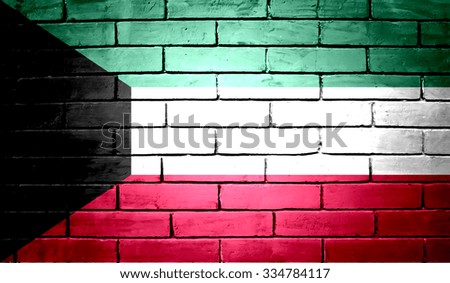 Kuwait Flag on a brick wall background
