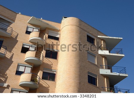 Modern building of apartments in brick with balcony