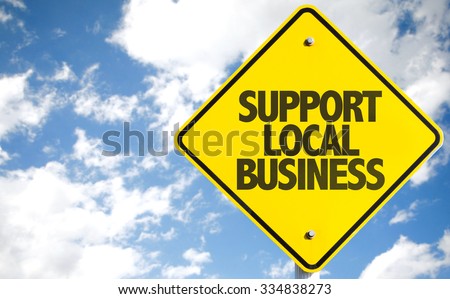 Support Local Business sign with sky background